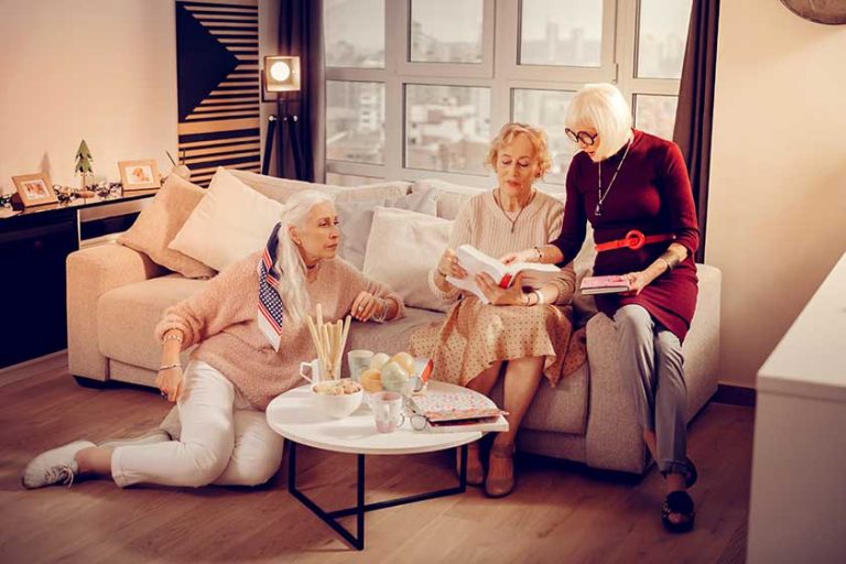 Nice pleasant senior women discussing fiction books