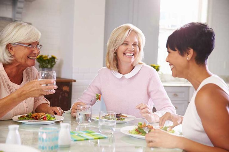 Group Of Mature Friends Enjoying Meal
