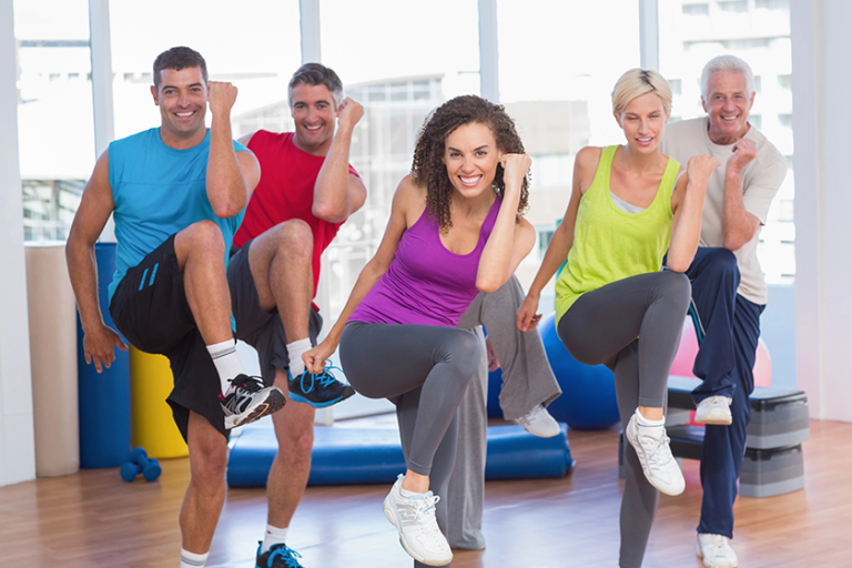 people-performing-aerobics-exercise-in-gym-class