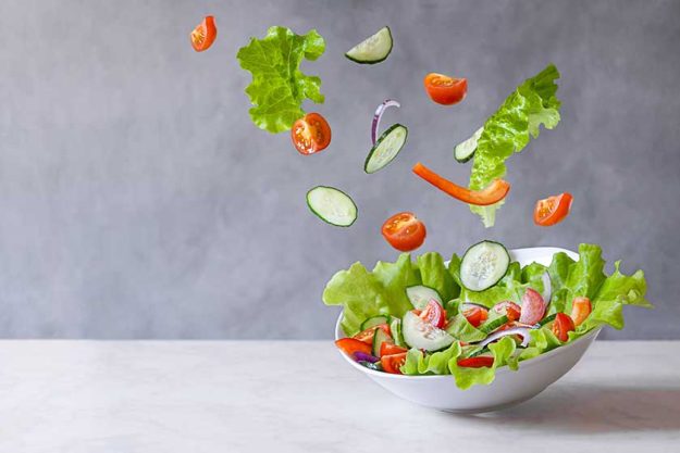 Levitation of vegetarian green salad made of green leaf Levitation of vegetarian green salad made of green leaf