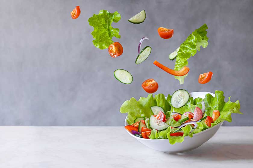 Levitation of vegetarian green salad made of green leaf Levitation of vegetarian green salad made of green leaf