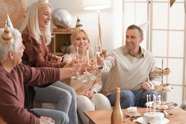Mature people with champagne celebrating
