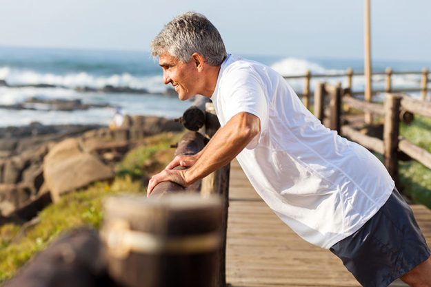Fit senior man exercising at the beach Fit senior man exercising at the beach