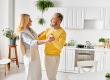 mature-loving-couple-clad-cozy-homewear-joyfully-dancing-together