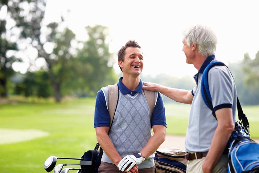 Male-golfer-in-conversation-with-his-father.-Male-golfer Male-golfer-in-conversation-with-his-father.-Male-golfer