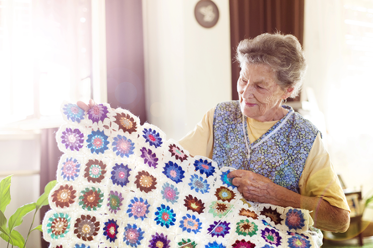 old-woman-is-knitting-a-blanket