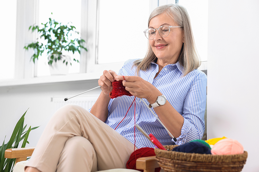 smiling-senior-woman-knitting