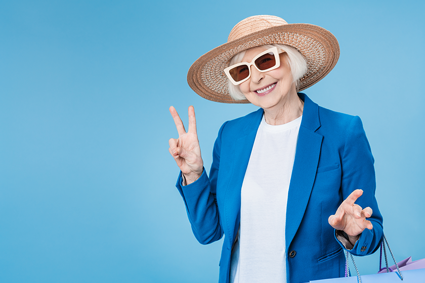 Mature woman in enjoying good shopping with bags