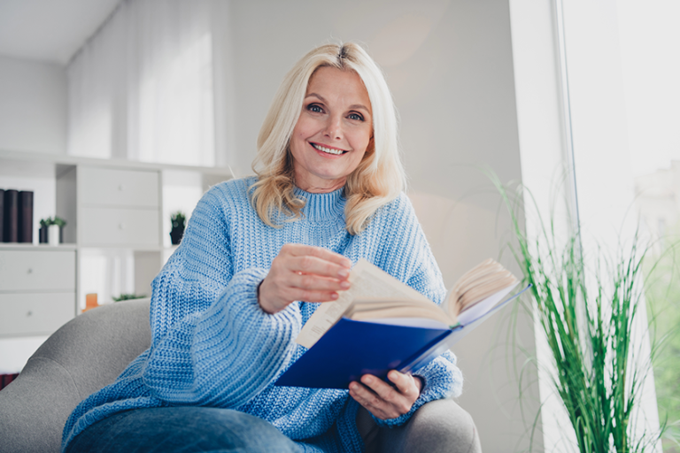 Photo of pretty aged woman enjoy read book