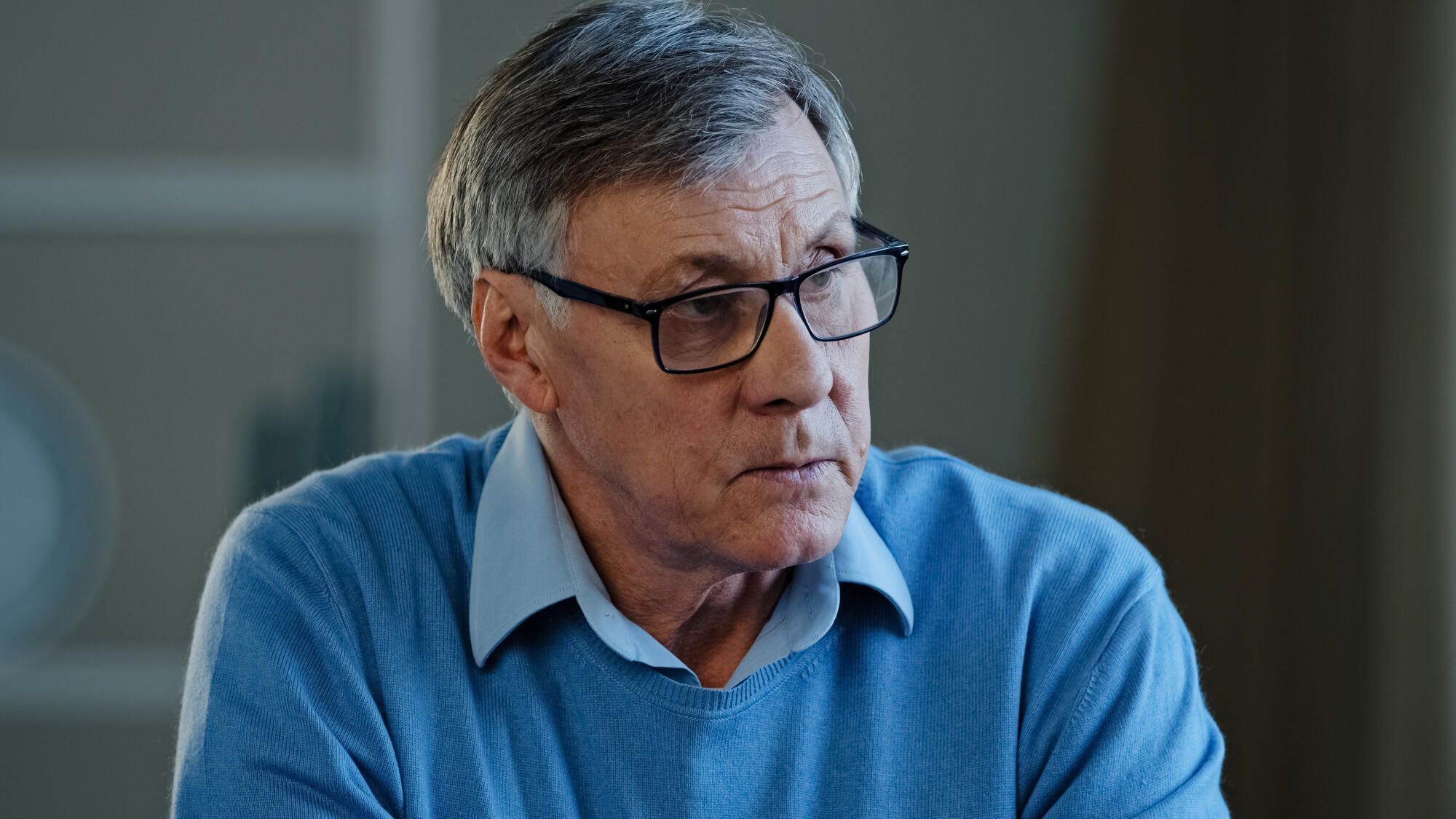 Close up old thoughtful pensive confused senior man feel worried think memory problem forgotten information, elderly old teacher look away anxious about trouble in office at home thinking pondering
