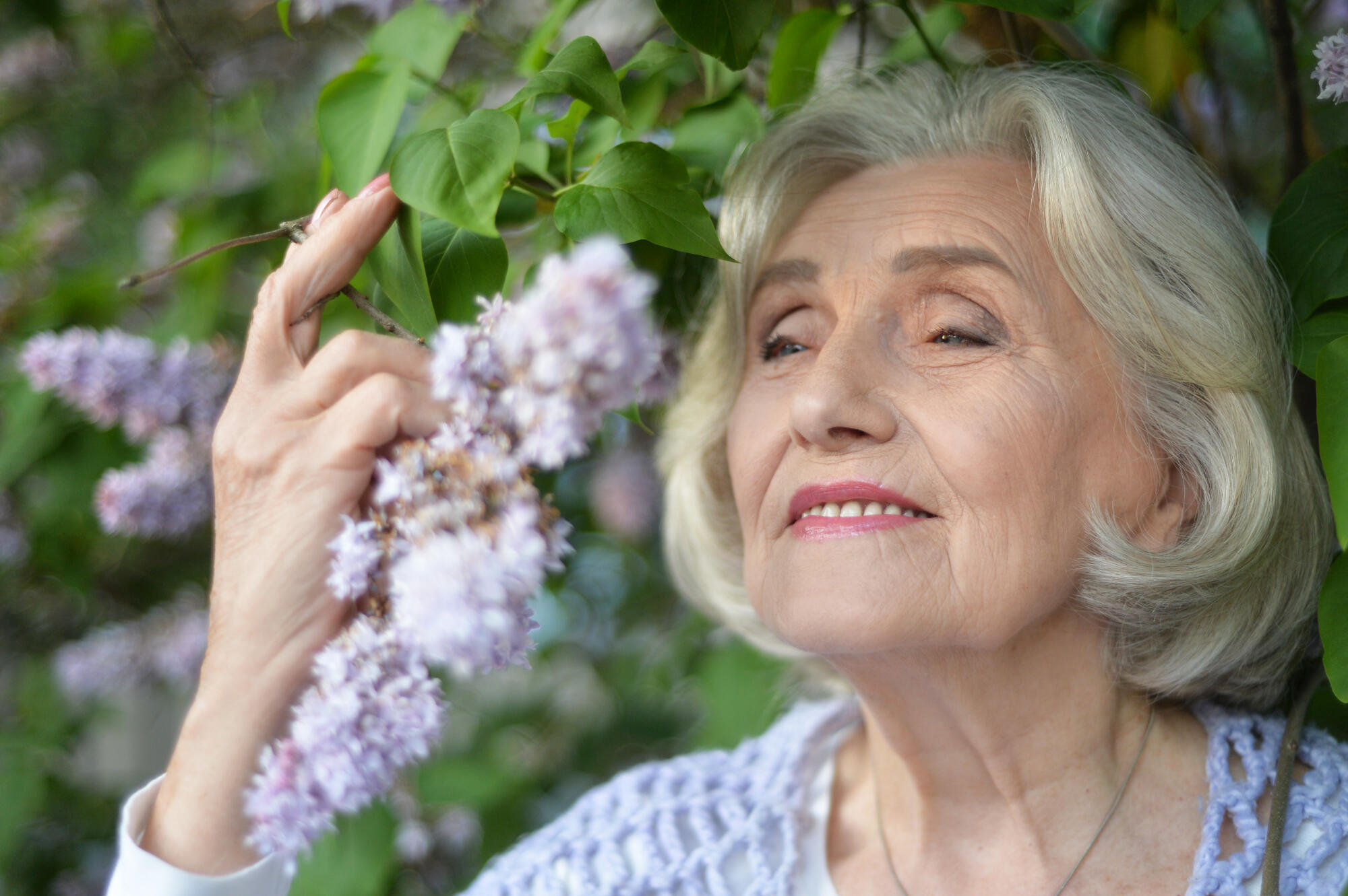 Portrait of a beautiful woman in the park in summer