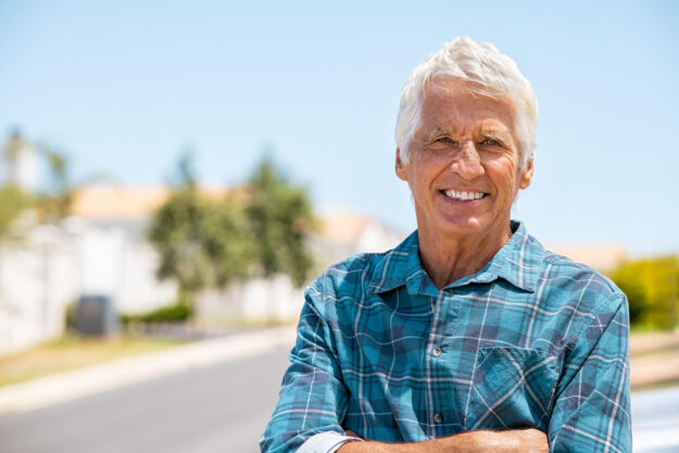 Retired,Old,Man,Standing,Outdoor,With,Folded,Arms,Smiling,And
