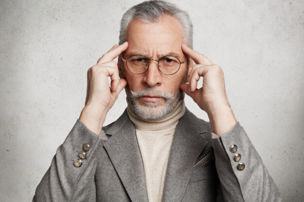 Close,Up,Portrait,Of,Focused,Grey,Haired,Mature,Wrinkled,Man